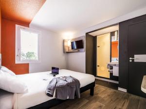 Postel nebo postele na pokoji v ubytování Ibis Budget Perpignan Sud