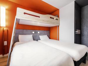 Postel nebo postele na pokoji v ubytování Ibis Budget Perpignan Sud