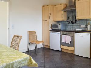 Kuchyň nebo kuchyňský kout v ubytování Graham Cottage