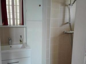 a bathroom with a shower with a glass door at Maison de maître XIXe avec piscine partagée et parc clos, proche sites touristiques - FR-1-489-504 in Gipcy +12 photos