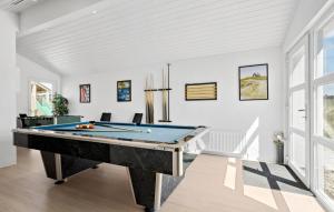 a billiard room with a pool table at Stunning Home In Blokhus With Sauna in Blokhus