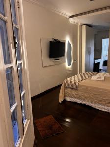 TV a/nebo společenská místnost v ubytování Estadia das Gerais - Casa de hóspedes adorável com Jacuzzi