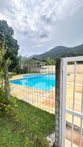 Bazén v ubytování Ap Ubatuba nebo v jeho okolí