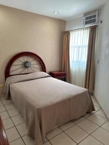 a bedroom with a large bed and a window at Casa Caracol in Puerto Vallarta +17 photos