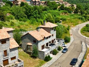 a house on a hill next to a road at El Balcón de Gavín in Gavín