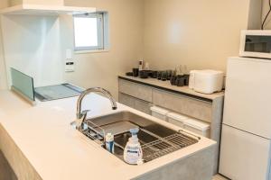 Kuchyň nebo kuchyňský kout v ubytování CORAL ISLAND - Vacation STAY 86340v + 34 fotografií