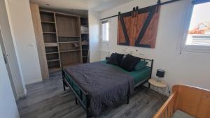 a small bedroom with a bed in a room at Villa Boubou 10 chambre in Troarn +27 photos