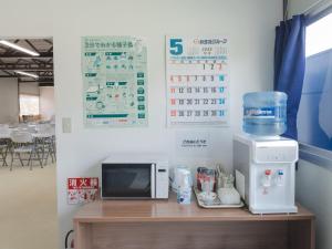TV a/nebo společenská místnost v ubytování 住吉ビレッジ種子島