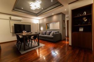 a living room with a table and a couch at HOTEL SPICE - Vacation STAY 34504v in Ishigaki Island +18 photos