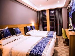 Postel nebo postele na pokoji v ubytování Shell Hotel Jiangxi Fuzhou Linchuan Avenue