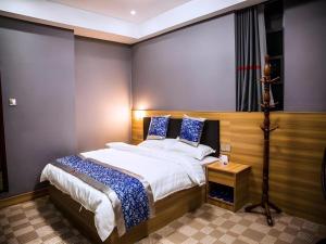 Postel nebo postele na pokoji v ubytování Shell Hotel Jiangxi Fuzhou Linchuan Avenue + 20 fotografií