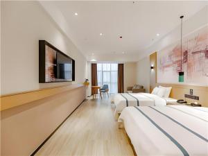 Μια τηλεόραση ή/και κέντρο ψυχαγωγίας στο City Comfort Inn Dongguan Dalingshan Xinli Agricultural Wholesale