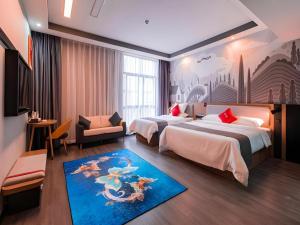 a hotel room with two beds and a blue rug at Thank Inn Guizhou Bijie Qianxi County High-Speed Railway Station in Qianxi +198 photos