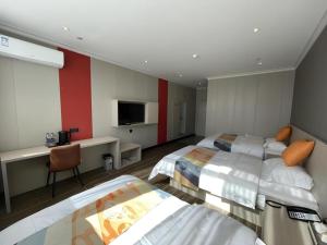 Μια τηλεόραση ή/και κέντρο ψυχαγωγίας στο Shell Hotel Huai'an Zhuqiao Industrial Park