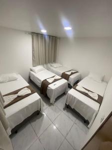 Una cama o camas en una habitación de Rede de Hotel 99