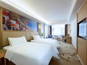 TV a/nebo společenská místnost v ubytování Vienna Hotel Hunan Ningyuan Jiuyi