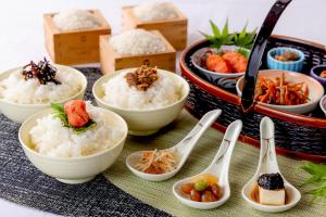 a table with bowls of rice and spoons at Hotel Mariners Court Tokyo in Tokyo