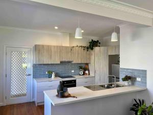 a kitchen with a sink and a counter top at Mildura Park Views in Mildura