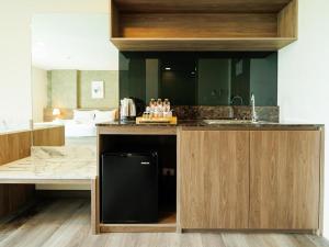 Kuchyň nebo kuchyňský kout v ubytování B2 Khon Kaen Premier Hotel