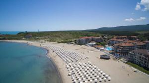 an aerial view of a beach with umbrellas at Sea view apartment in Tsarevo