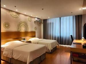 Postel nebo postele na pokoji v ubytování GreenTree Inn Weihai Rongcheng Haoyunjiao Tourist Resort + 118 fotografií