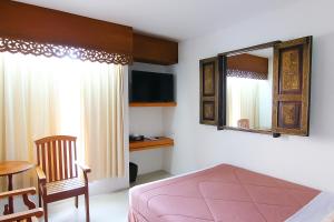 Rúm í herbergi á Bansabai Hostelling International