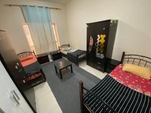 Letto o letti in una camera di سكن شباب بالتعاون - ALEX Hostel - Sharjah