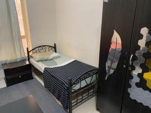 Letto o letti in una camera di سكن شباب بالتعاون - ALEX Hostel - Sharjah