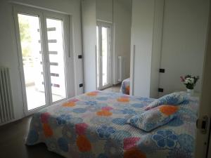 Postel nebo postele na pokoji v ubytování AKOJA Appartamento di pregio FRONTE MARE