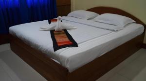 Postel nebo postele na pokoji v ubytování Lankham Hotel