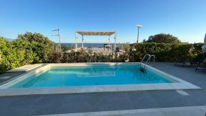 a small swimming pool in a yard at Le Villette in Cittadella del Capo
