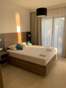 a bedroom with a large bed in a room at REZEVICI BOUTIQUE VILLA in Petrovac na Moru +37 photos