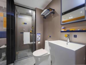 a bathroom with a toilet and a sink at 7 Days Inn Xi'an Xijing Hospital Tonghuamen Metro Station in Xi'an +112 photos