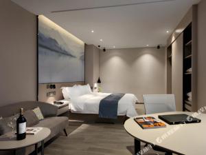 Postel nebo postele na pokoji v ubytování Shenzhen Hanyong Hotel Fuyong Branch + 37 fotografií