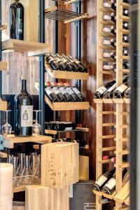 a display of wine bottles and wine glasses at Gut Sonnberghof in Mittersill +86 photos