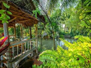 A garden outside Baan Suan Rim Num Resort