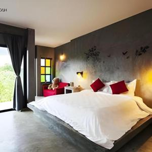 Un pat sau paturi într-o cameră la Baanwaan Resort