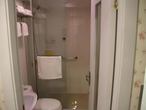 a bathroom with a shower with a toilet and a sink at Jinjiang Inn Shanghai Songjiang University Town in Chengxi +71 photos
