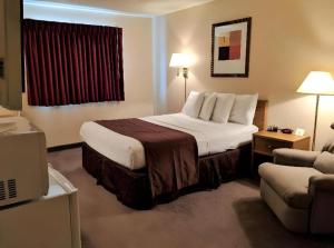 Ένα ή περισσότερα κρεβάτια σε δωμάτιο στο Americas Best Value Inn Torrington +33 φωτογραφίες
