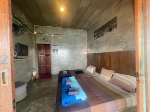 Postel nebo postele na pokoji v ubytování The Mae Homstayผาฮี้