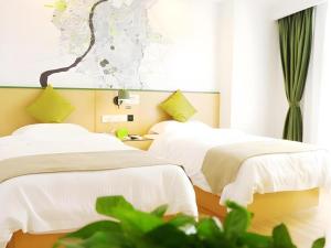 En eller flere senge i et værelse på Vatica Hefei Feidong County Yuzhou Central Square Hotel + 223 billeder