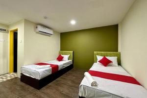 Postel nebo postele na pokoji v ubytování Hotel MSP Bukit Bintang