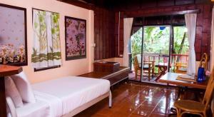 Ένα ή περισσότερα κρεβάτια σε δωμάτιο στο Chaweng Relax Resort +128 φωτογραφίες
