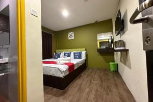 Postel nebo postele na pokoji v ubytování Hotel MSP Bukit Bintang