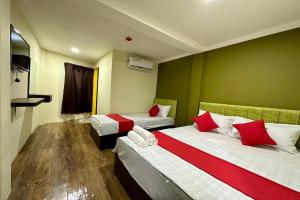 Postel nebo postele na pokoji v ubytování Hotel MSP Bukit Bintang