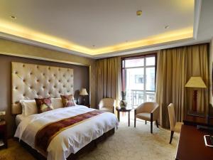 Ένα ή περισσότερα κρεβάτια σε δωμάτιο στο Wuhan Zall Royal Hotel- North Hankou International Hotel +186 φωτογραφίες