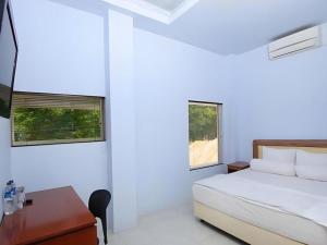 Postel nebo postele na pokoji v ubytování Hotel New Melati + 9 fotografií