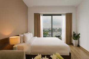 An Nguyen Lakeside Residence客房内的一张或多张床位