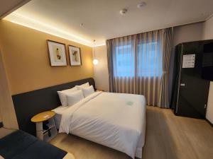 Postel nebo postele na pokoji v ubytování Hound Hotel Busan Station