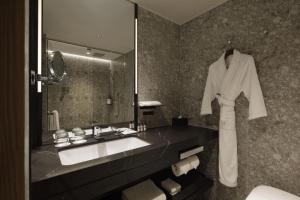 a bathroom with a sink and a mirror at Hyatt Regency Tokyo in Tokyo